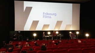 Salle de cinéma avec la présentation de Fribourg Films
